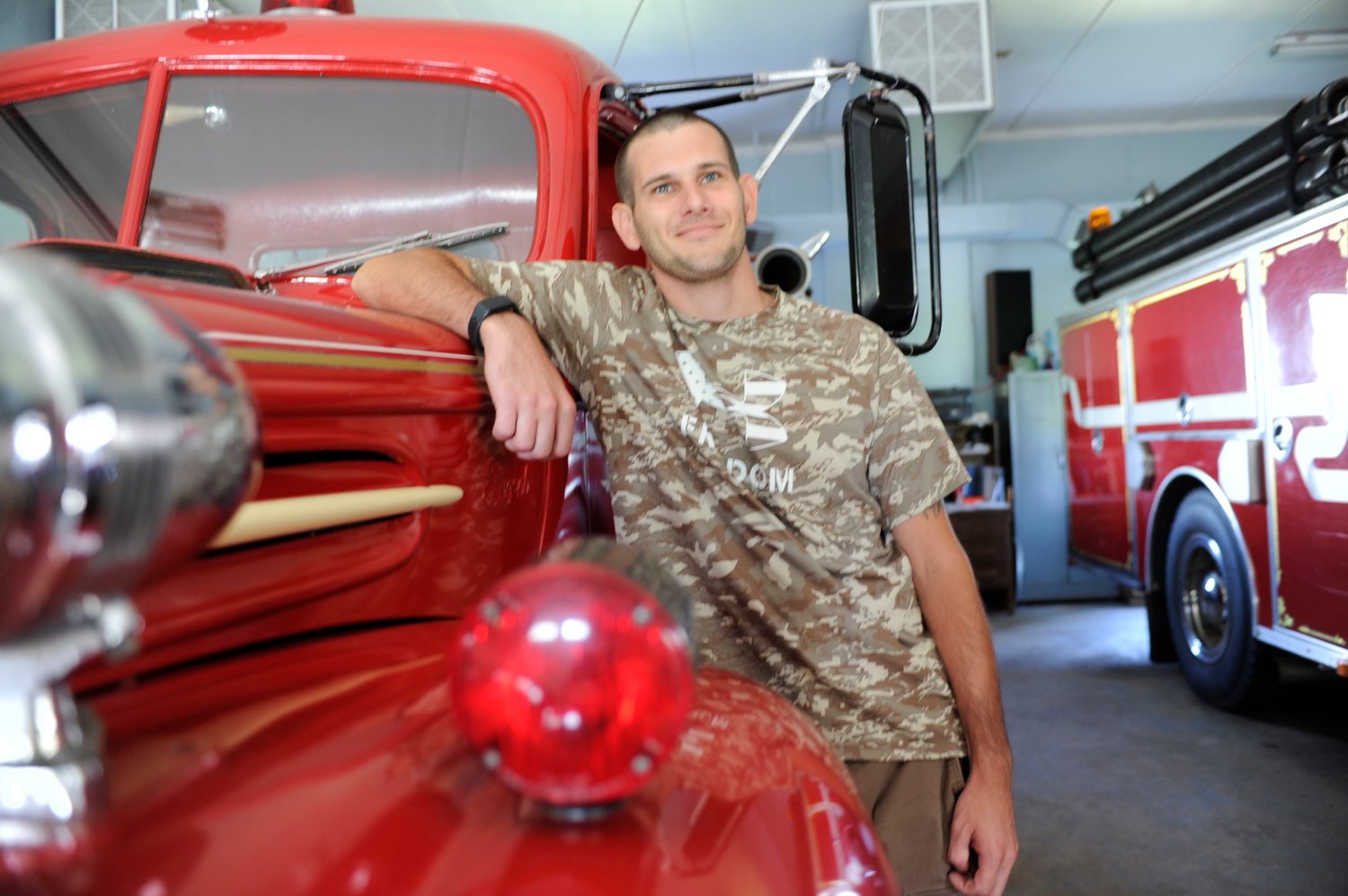 Jesse Campfield, Lava Fire Department’s 28-year old chief, joined the all-volunteer department as a 17-year-old in 2011. He is pictured with the department’s 1947 Ford engine apparatus.